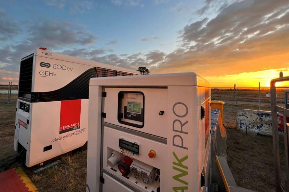 Hydrogen Generator and battery storage units sitting next to each other on site