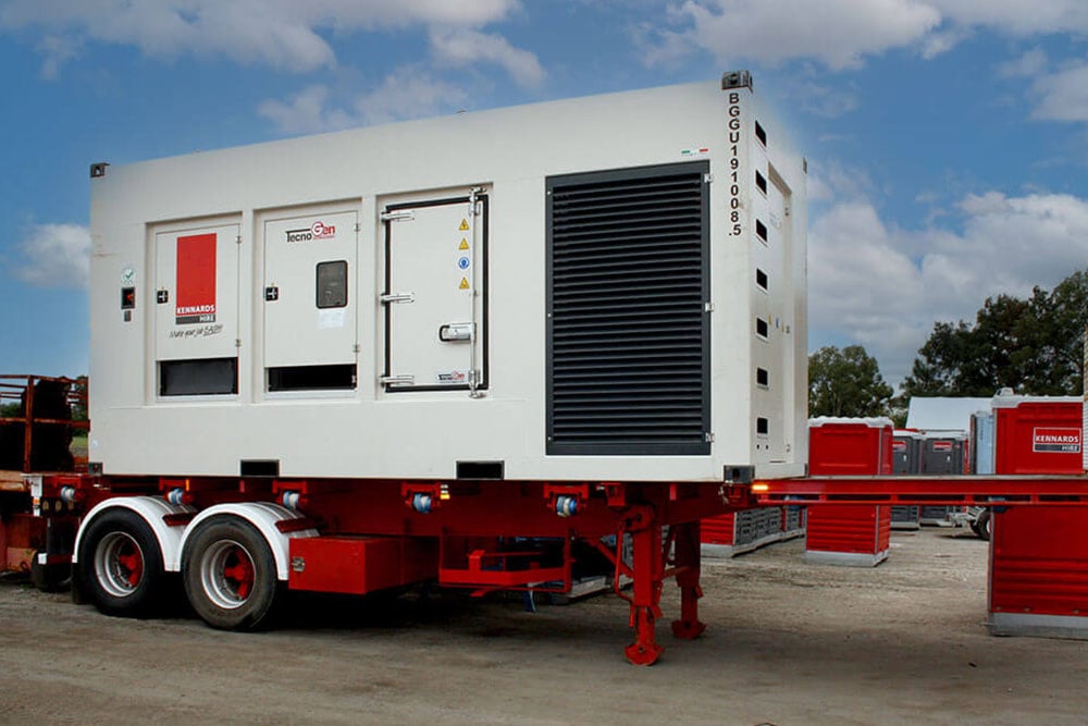 Kennards hire large white stationary generator on a worksite site